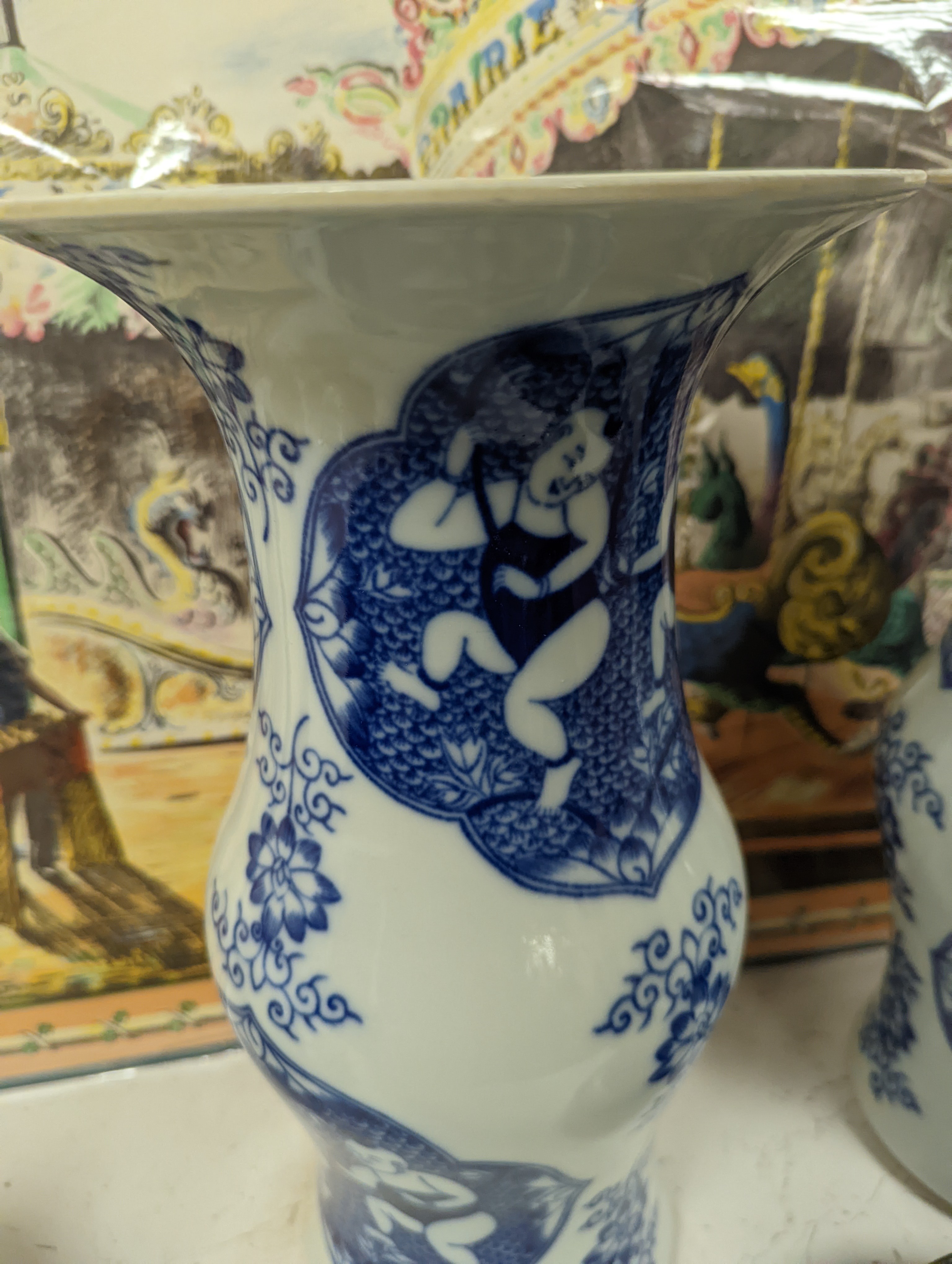 A pair of Chinese blue and white vases on stands and 6 further wood stands. Vases 35cm